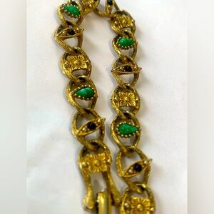 Gold tone and glass vintage bracelet green mottled and black stones 7.25